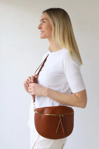 Model wearing Tan Cross Body Zip Detail Bag By Archer House Available at Beetees Nelson